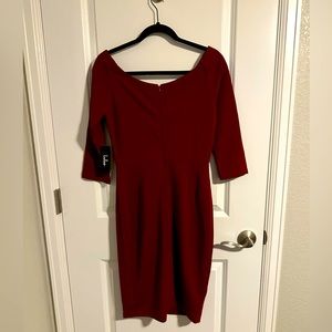 This is a deep red 3/4 sleeve cocktail dress. Perfect for work or a party. New